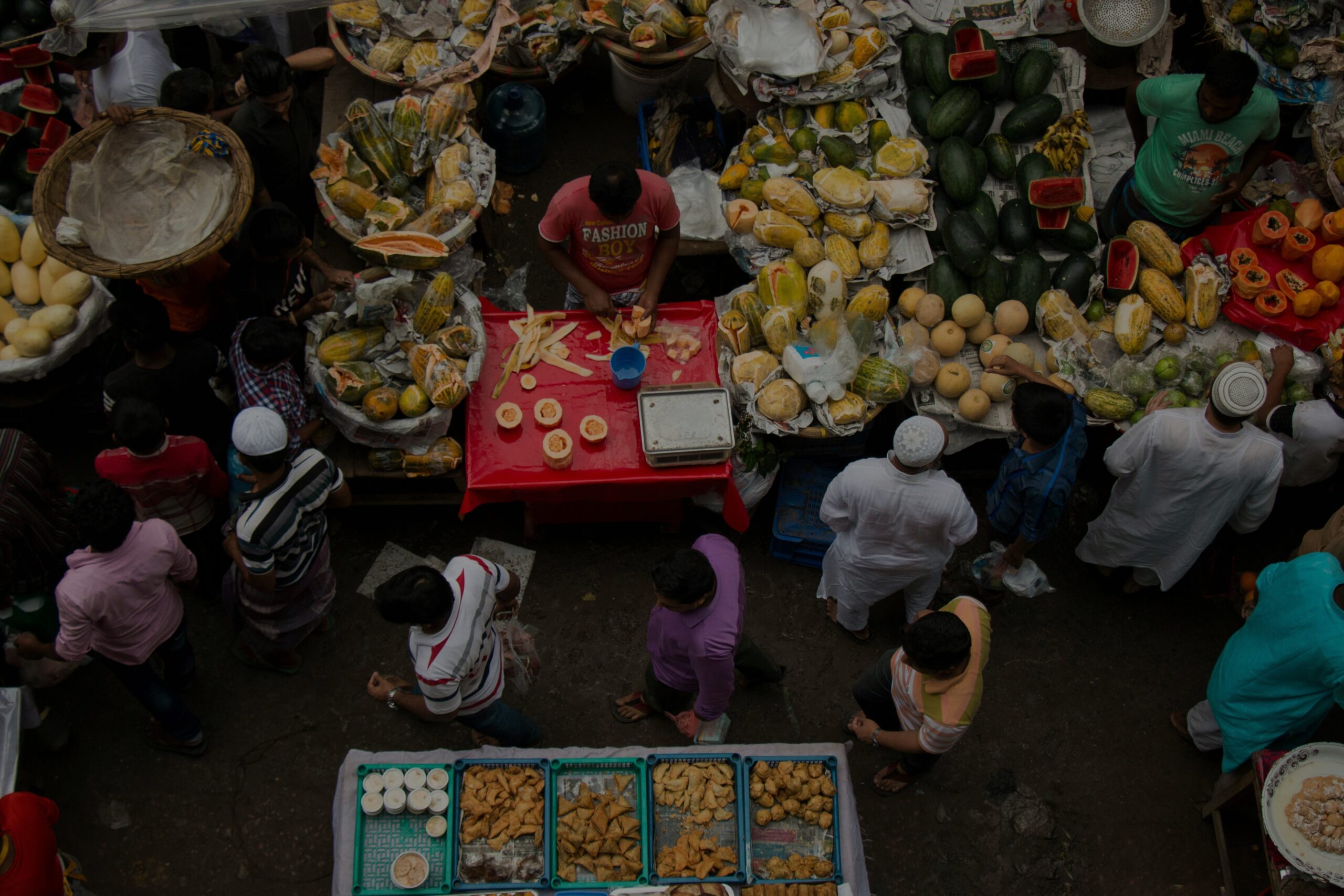 Vertical view of a food market, selling fruits and vegetables.
