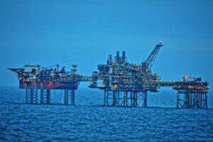 An oil platform standing out above the sea