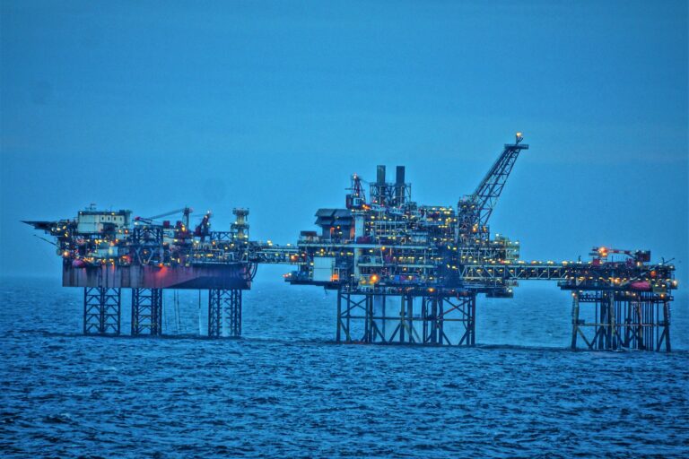 An oil platform standing out above the sea