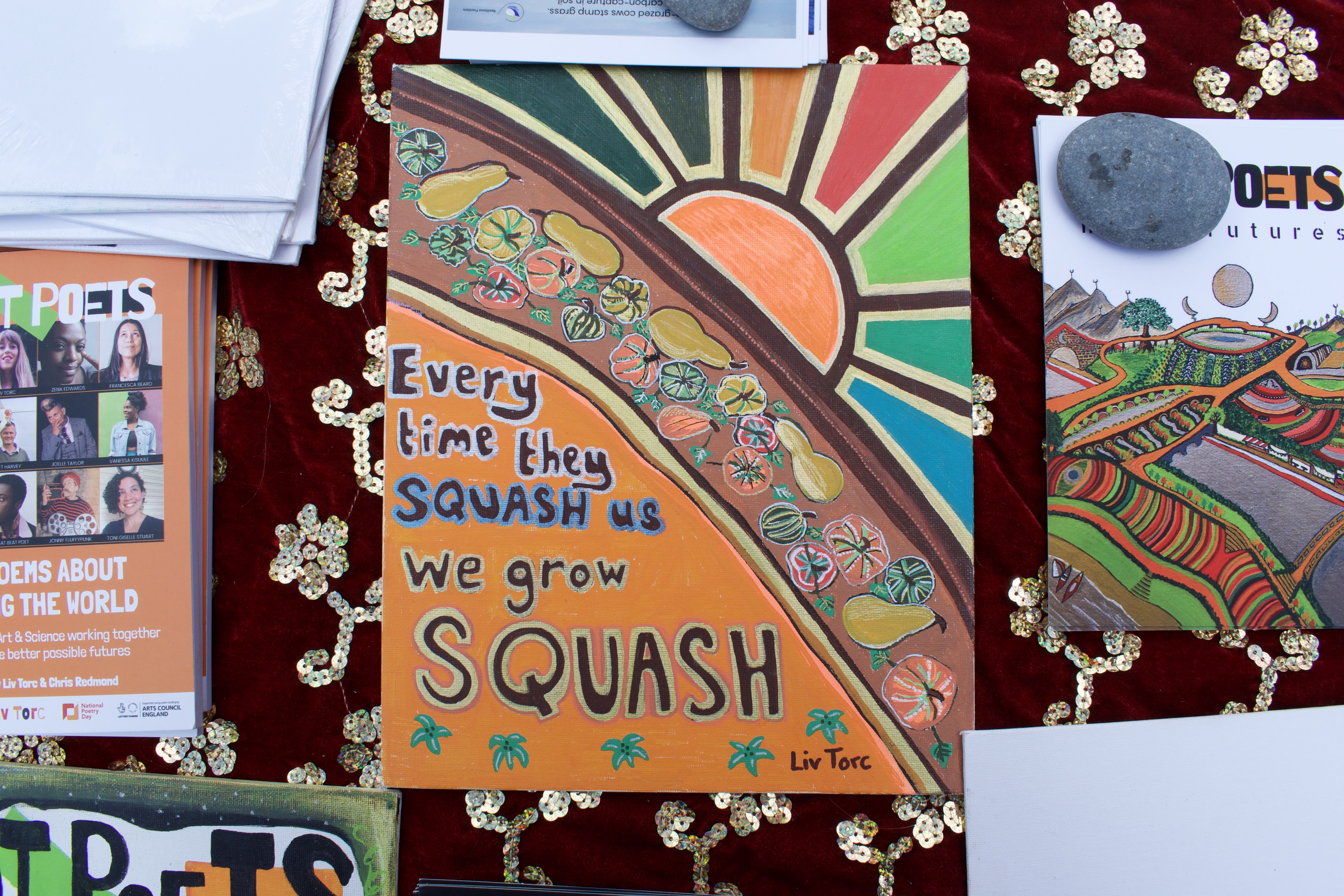 Hot Poets artwork on their poetry stall