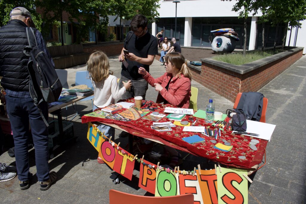 Liv Torc at her poetry stall at the We Feed The UK event. 