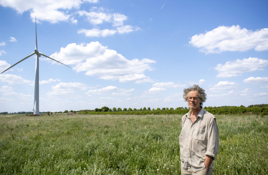 An image of a farmer with a wind turbine