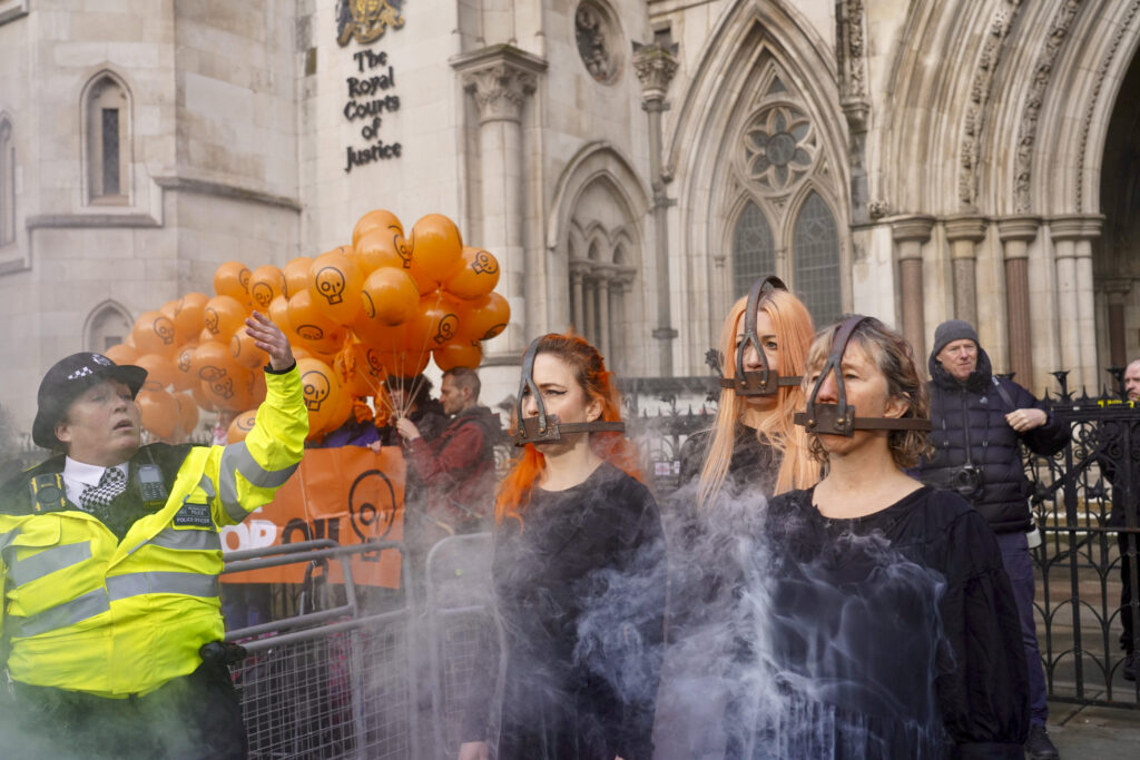 Just Stop Oil activists demonstrate outside the Royal Courts of Justice in support of activists appealing their prison sentences for peaceful protest