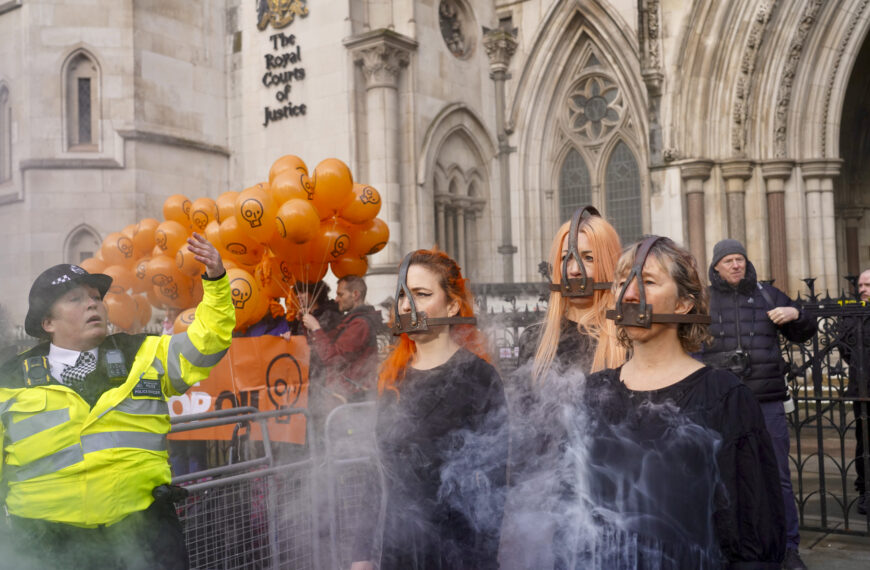 Just Stop Oil activists demonstrate outside the Royal Courts of Justice in support of activists appealing their prison sentences for peaceful protest