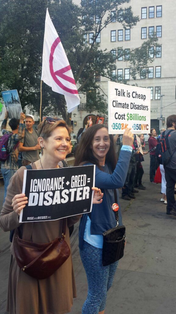 Campaigners holding signs protesting in the street of New York