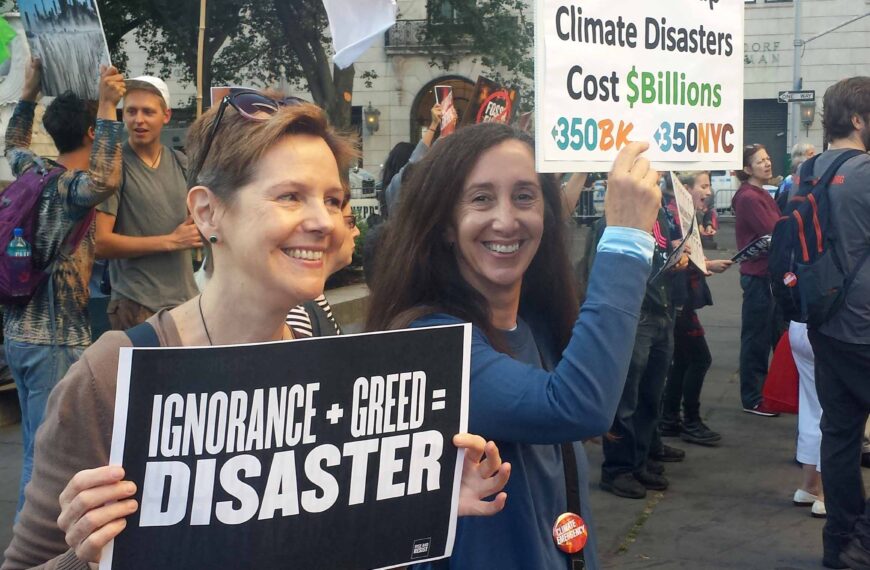 Campaigners holding signs protesting in the street of New York