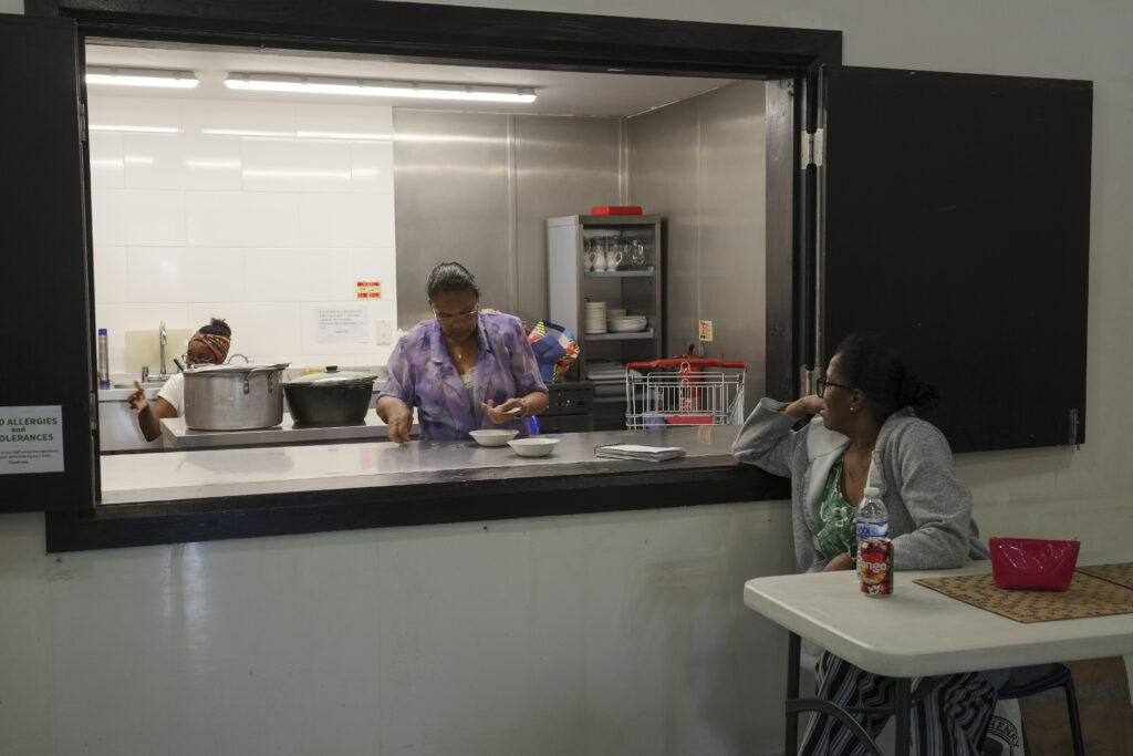 Members of the Chagossian community in Crawley pack away lunch club.